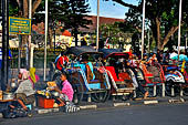 Riding the becak, the local cycle rickshaws in Malioboro street Yogyakarta. 